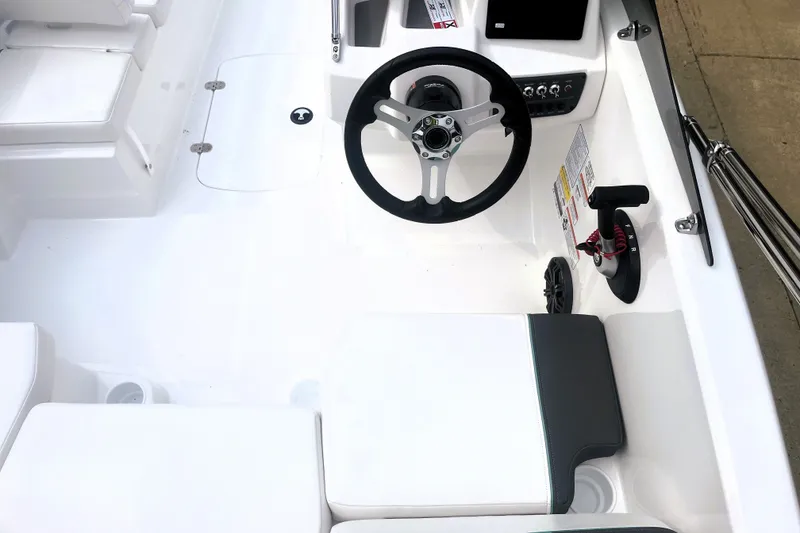 Slide: The Image of Interior of a 2027 Tahoe T16 boat featuring steering wheel and control panel. - 5