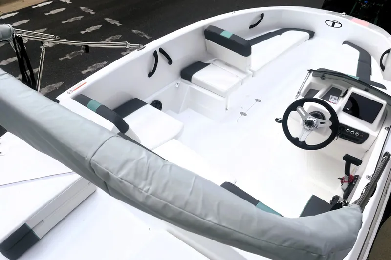 Slide: The Image of 2027 Tahoe T16 boat interior with modern steering and seating arrangement. - 4