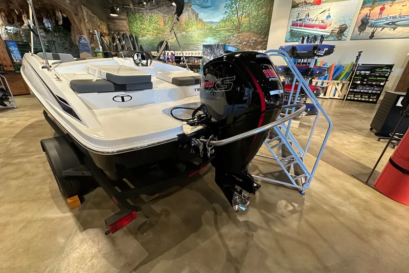 Slide: The Image of 2027 Tahoe T18 boat with Mercury Pro XS engine displayed indoors. - 3
