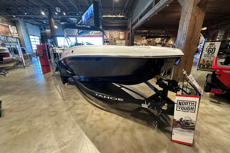 Slide: The Image of 2027 Tahoe T18 boat displayed indoors on a trailer, showcasing sleek design and modern features. - 4