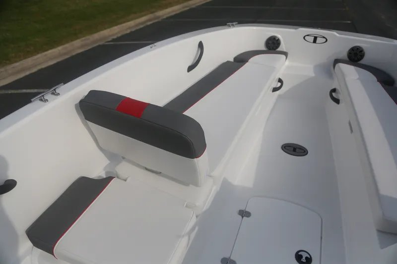 Slide: The Image of 2027 Tahoe T18 boat interior with white and gray seating, red accents, and speaker system. - 5