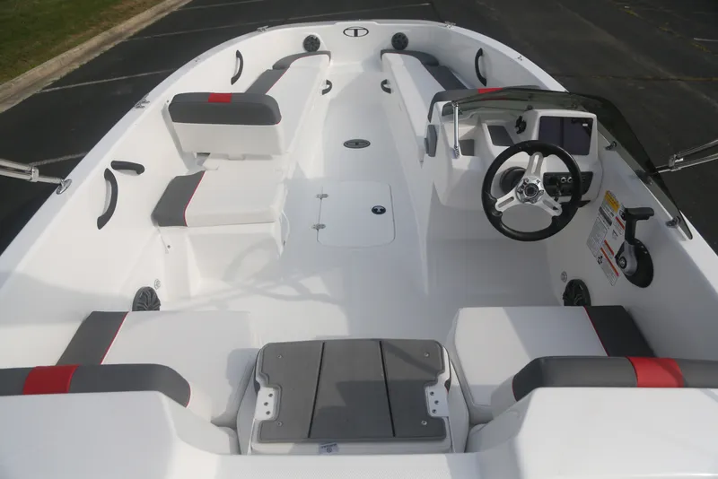 Slide: The Image of 2027 Tahoe T18 boat interior with modern seating and steering console. - 3