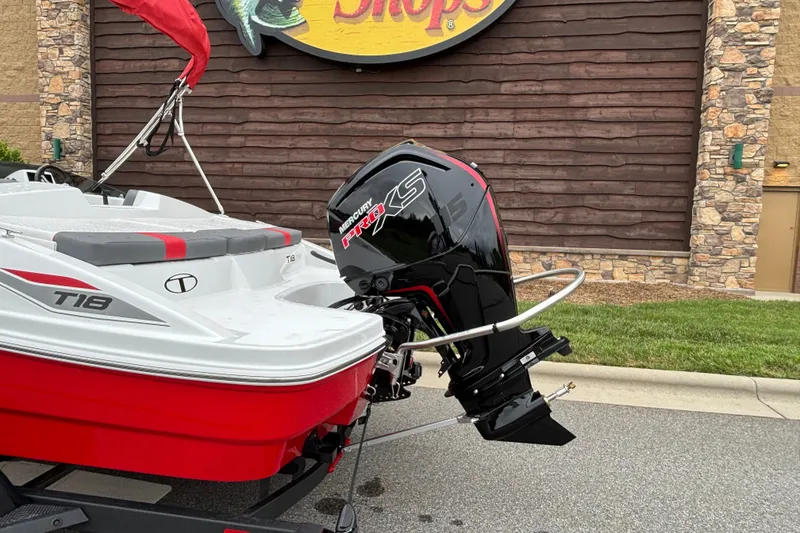 Slide: The Image of 2027 Tahoe T18 boat with Mercury Pro XS engine, parked outdoors. - 71