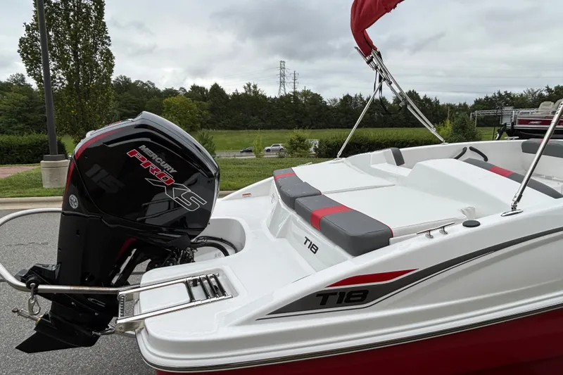 Slide: The Image of 2027 Tahoe T18 boat with Mercury Pro XS engine, parked outdoors. - 72
