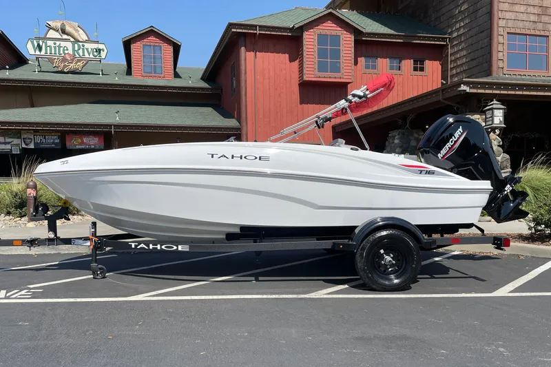 Slide: The Image of 2027 Tahoe T16 boat on trailer outside White River Fly Shop. - 1