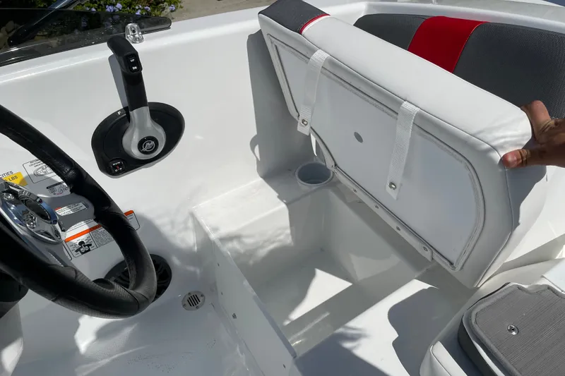 Slide: The Image of Interior of 2027 Tahoe T16 boat showing steering wheel and adjustable seat. - 17