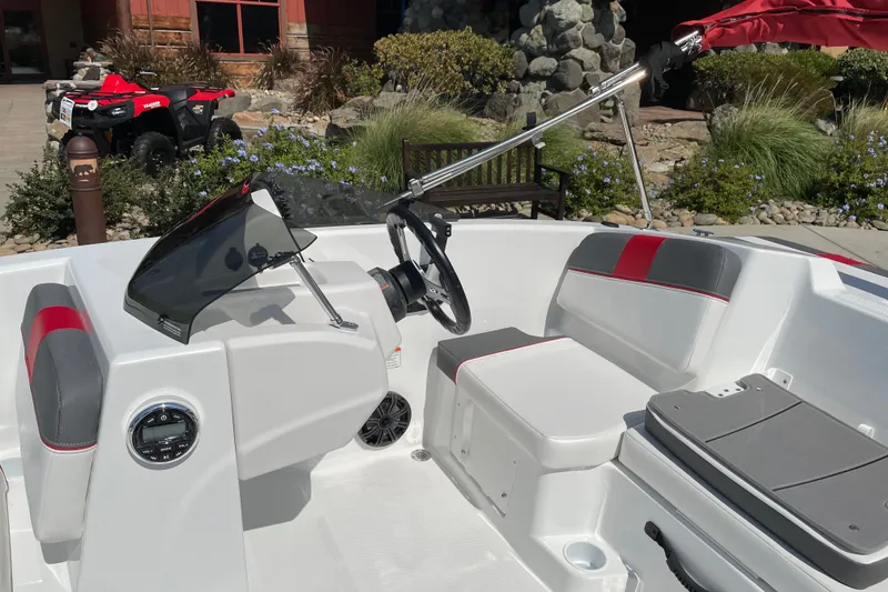 Slide: The Image of Interior of a 2027 Tahoe T16 boat with modern seating and steering console. - 9