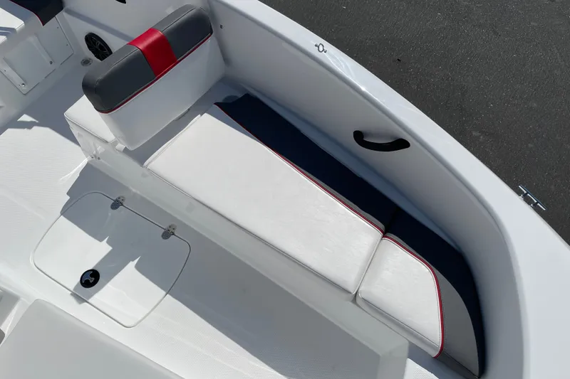 Slide: The Image of 2027 Tahoe T16 boat interior with white and red cushioned seating. - 11