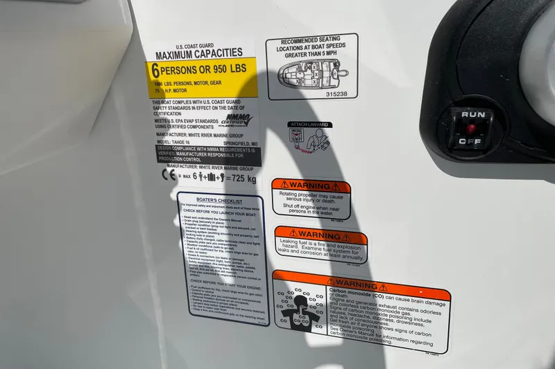 Slide: The Image of Safety and capacity labels on a 2027 Tahoe T16 boat, detailing warnings and maximum load. - 20