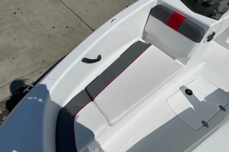 Slide: The Image of 2027 Tahoe T16 boat interior with white and gray seating, red accents. - 13