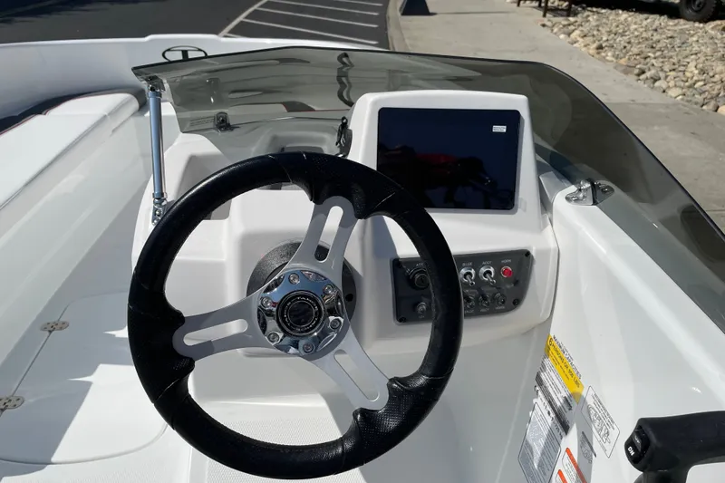 Slide: The Image of Steering console of 2027 Tahoe T16 boat with modern controls and display. - 19