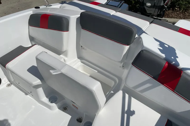 Slide: The Image of 2027 Tahoe T16 boat interior with gray and red cushioned seating. - 18