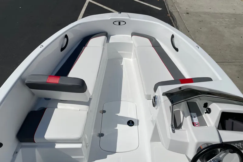 Slide: The Image of 2027 Tahoe T16 boat interior with sleek white seating and modern dashboard design. - 10