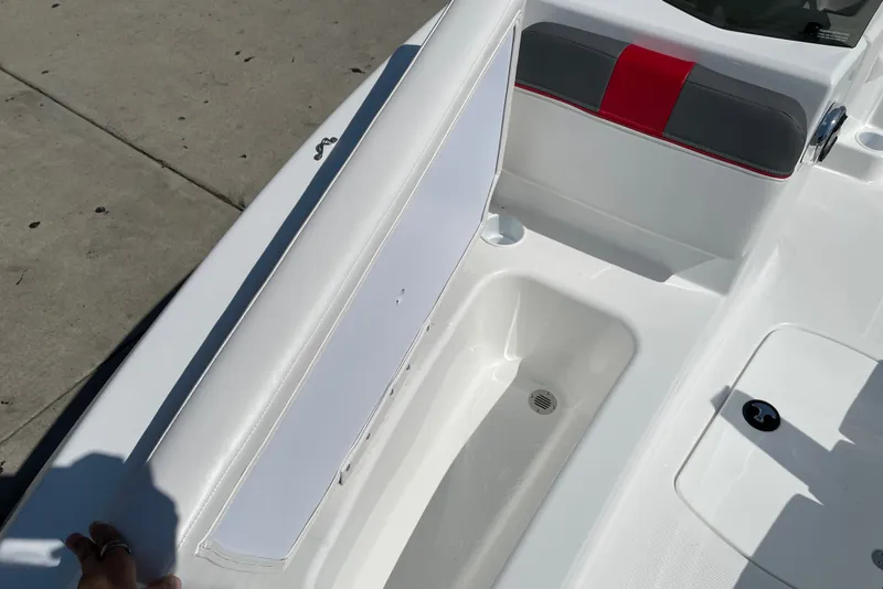 Slide: The Image of 2027 Tahoe T16 boat interior with white seating and storage compartment. - 15