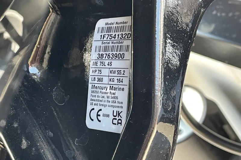 Slide: The Image of Label on Mercury Marine engine part, showing model and serial numbers, specifications, and compliance marks. - 81