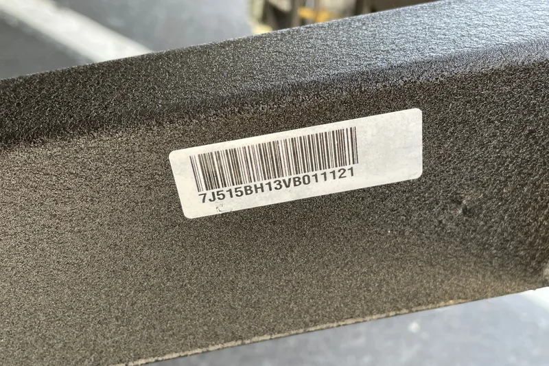 Slide: The Image of Barcode label on a 2027 Tahoe T16 vehicle component. - 82