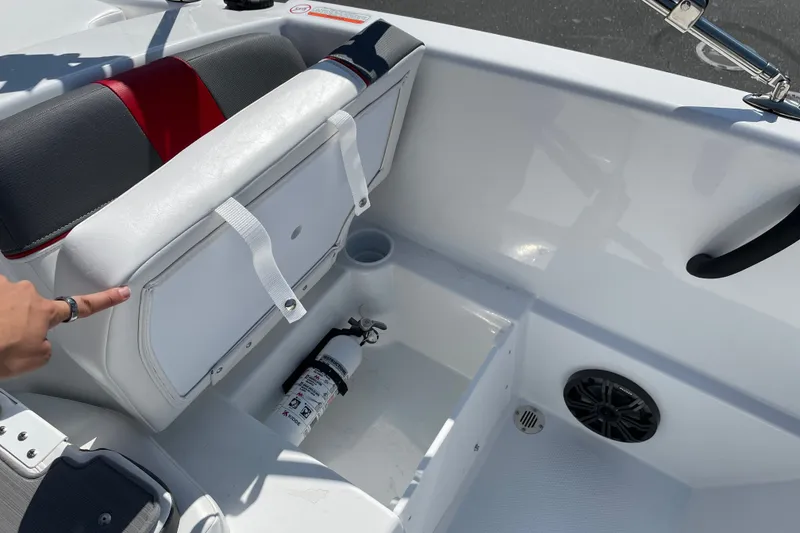 Slide: The Image of Interior of 2027 Tahoe T16 boat showing storage compartment and fire extinguisher. - 16