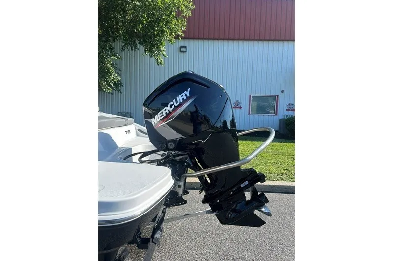 Slide: The Image of 2027 Tahoe T16 boat with Mercury outboard motor in a sunny outdoor setting. - 5