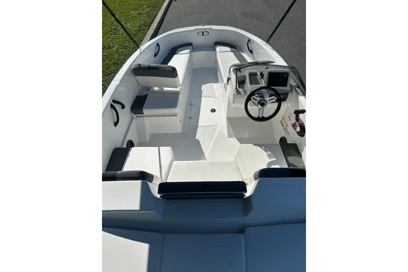 Slide: The Image of 2027 Tahoe T16 boat interior with seating, steering wheel, and control panel. - 7