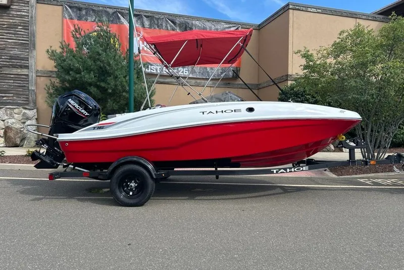 The Image of 2027 Tahoe T16 boat with red hull and Mercury engine on trailer. - 0