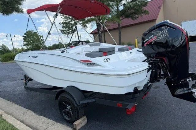 The Image of 2027 Tahoe T18 boat with red canopy and powerful outboard motor on trailer. - 0