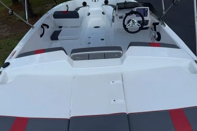 Slide: The Image of 2027 Tahoe T18 boat interior with seating, steering wheel, and modern dashboard. - 7