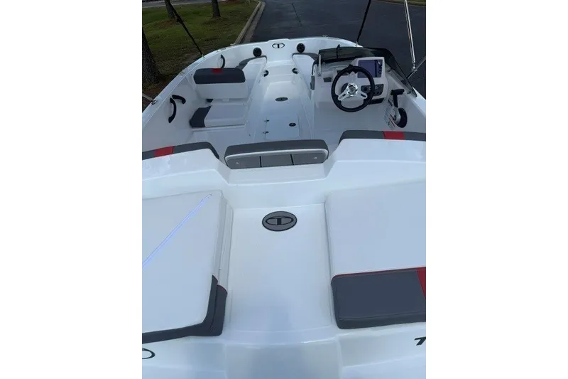 Slide: The Image of 2027 Tahoe T18 boat interior with modern seating and steering wheel. - 8