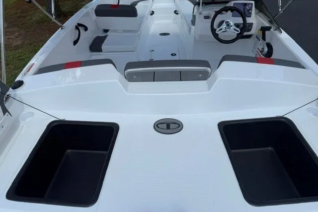 Slide: The Image of 2027 Tahoe T18 boat interior with seating, steering wheel, and storage compartments. - 6