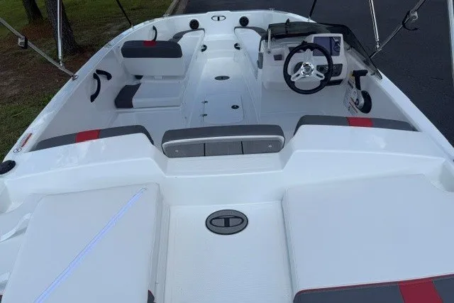 Slide: The Image of 2027 Tahoe T18 boat interior with modern seating and steering console. - 5