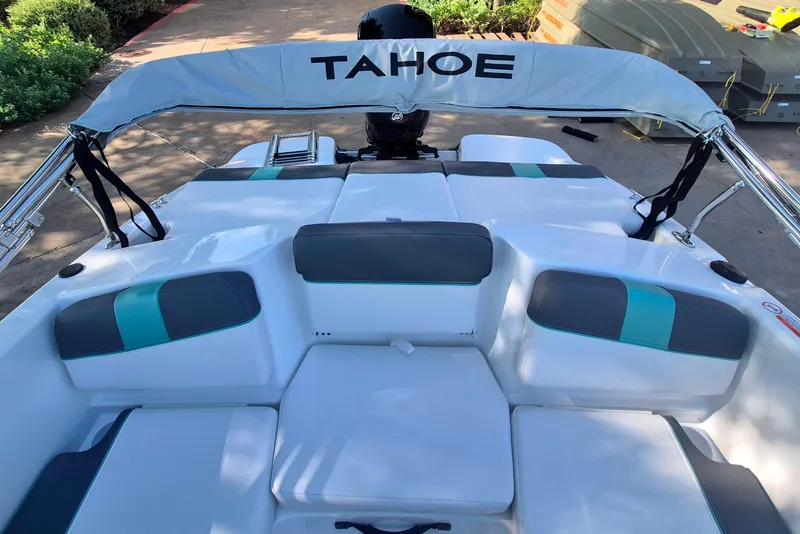 Slide: The Image of 2027 Tahoe T16 boat interior with white and teal seating, showcasing modern design. - 13