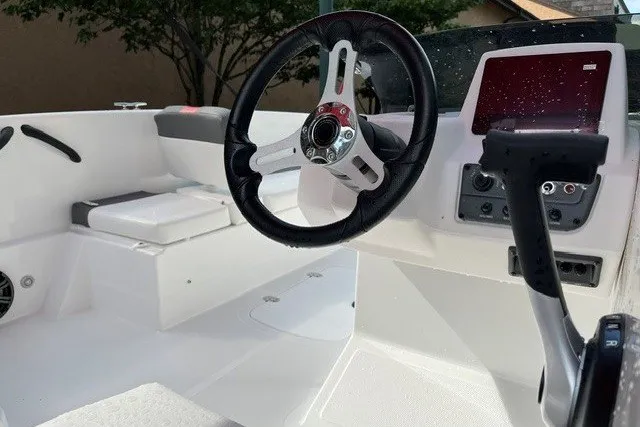 Slide: The Image of 2027 Tahoe T18 boat interior with steering wheel and control panel. - 5