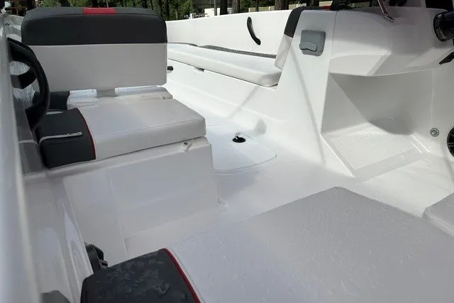 Slide: The Image of 2027 Tahoe T18 boat interior with white seating and modern design. - 10
