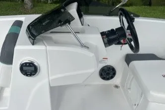 Slide: The Image of 2027 Tahoe T16 boat cockpit with steering wheel and control panel. - 4