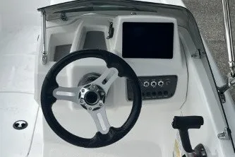 Slide: The Image of Steering console of 2027 Tahoe T16 boat with modern controls and display. - 1