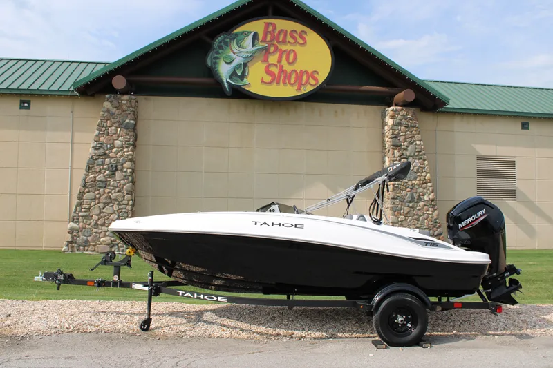 The Image of 2027 Tahoe T16 boat on trailer outside Bass Pro Shops store. - 0