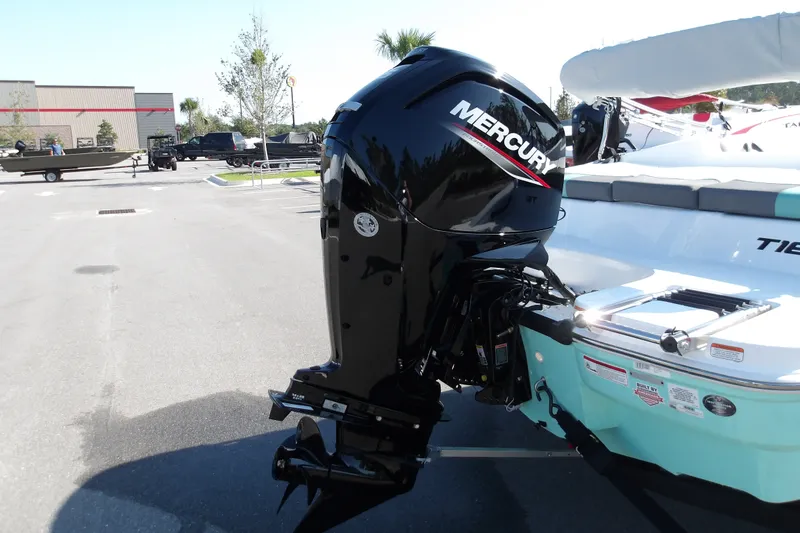 Slide: The Image of 2027 Tahoe T16 boat with Mercury outboard motor in a parking lot. - 8