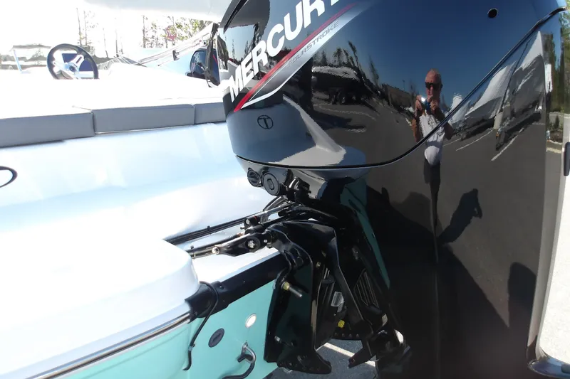 Slide: The Image of 2027 Tahoe T16 boat with Mercury outboard motor, reflecting surroundings. - 7