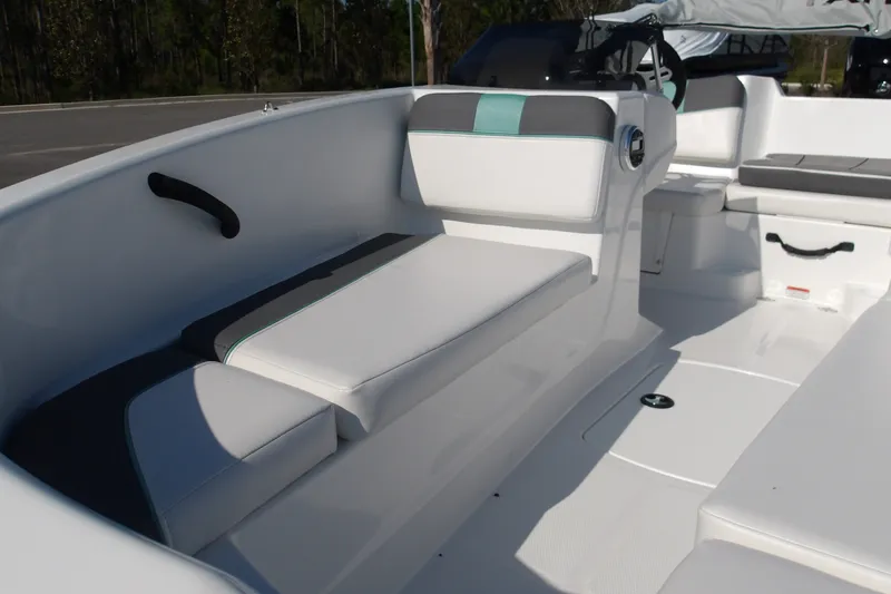 Slide: The Image of 2027 Tahoe T16 boat interior with white and gray seating, modern design. - 14