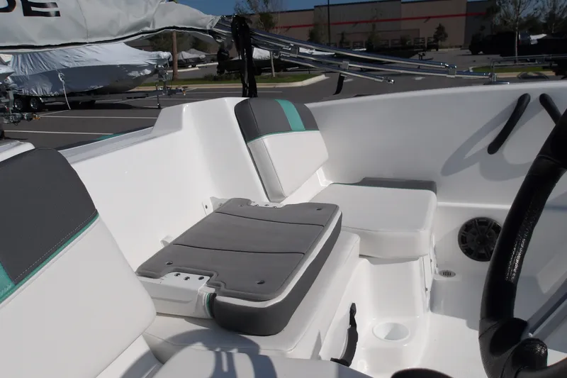 Slide: The Image of Interior of a 2027 Tahoe T16 boat featuring cushioned seating and modern design elements. - 13