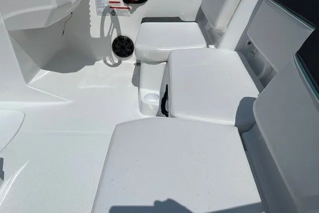 Slide: The Image of Interior of a 2027 Tahoe T16 boat featuring white seating and modern design elements. - 6