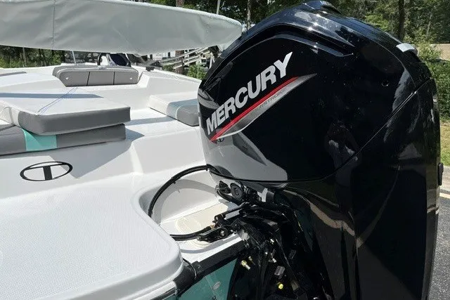 Slide: The Image of Tahoe T16 2027 boat with Mercury outboard motor, featuring cushioned seating and sleek design. - 5