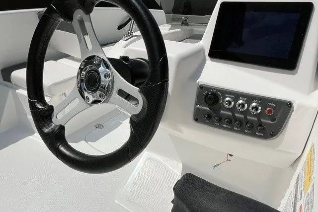 Slide: The Image of Steering console of 2027 Tahoe T16 boat with control panel and display screen. - 8