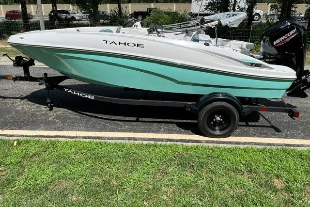 Slide: The Image of 2027 Tahoe T16 boat on trailer, featuring sleek design and turquoise hull. - 1
