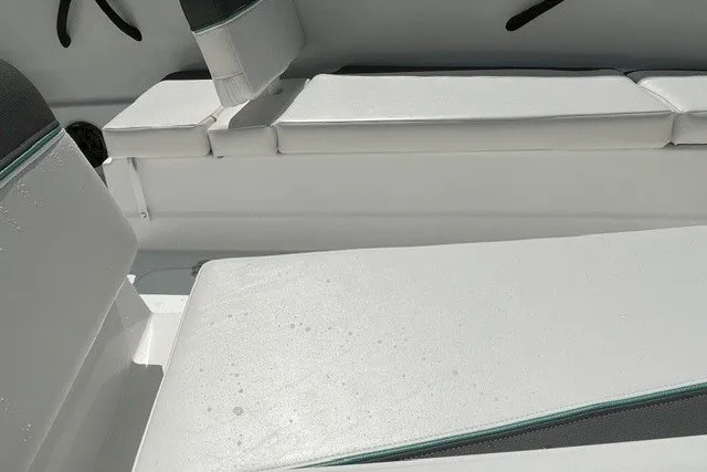 Slide: The Image of Interior seating of a 2027 Tahoe T16 boat, featuring white cushioned seats. - 10