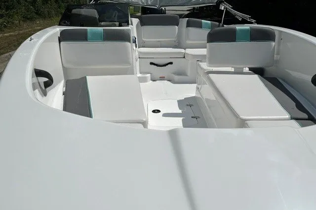 Slide: The Image of 2027 Tahoe T16 boat interior with white and gray seating, modern design. - 4