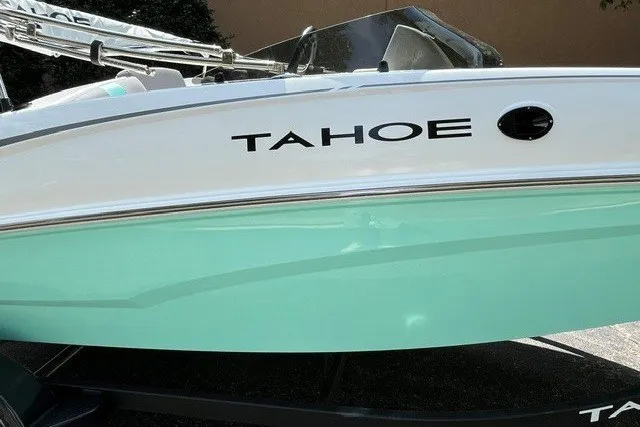 Slide: The Image of 2027 Tahoe T16 boat with sleek design and mint green hull. - 12