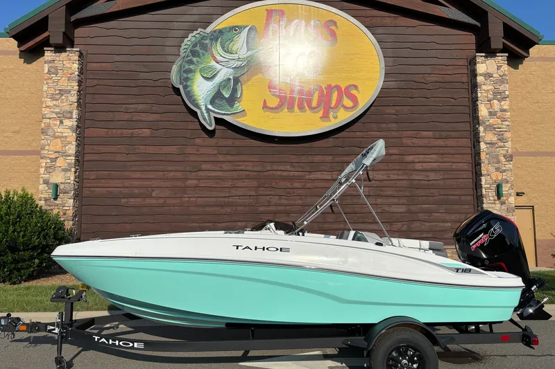 The Image of 2027 Tahoe T18 boat displayed outside Bass Pro Shops, featuring a sleek design and vibrant colors. - 0