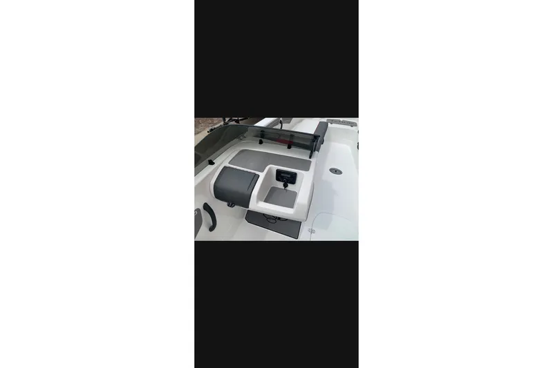 Slide: The Image of 2027 Tahoe T21 boat interior with seating and storage compartments. - 3