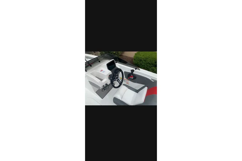 Slide: The Image of Cockpit of 2027 Tahoe T21 boat with steering wheel and control panel. - 4