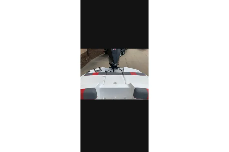 Slide: The Image of 2027 Tahoe T21 boat rear view with motor, featuring sleek design and modern aesthetics. - 8